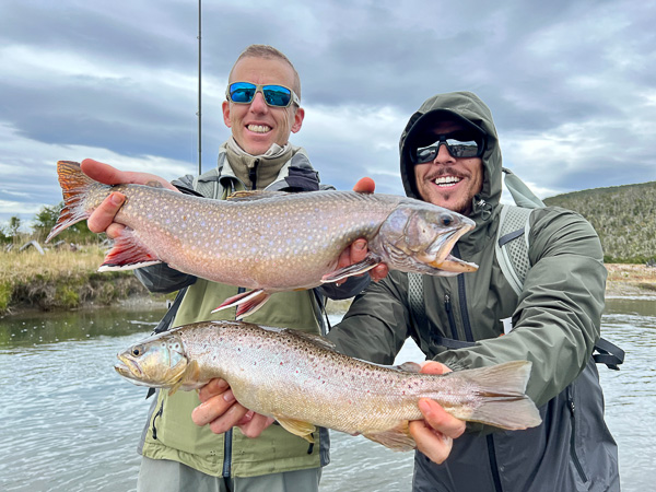 Two anglers fishing a prime brook and brown trouts in Tierra del Fuego