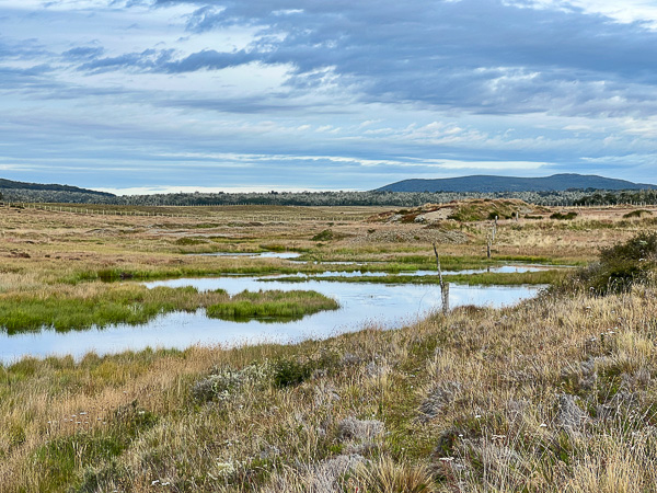 Wide valley with trout river in Tierra del Fuego Patagonia